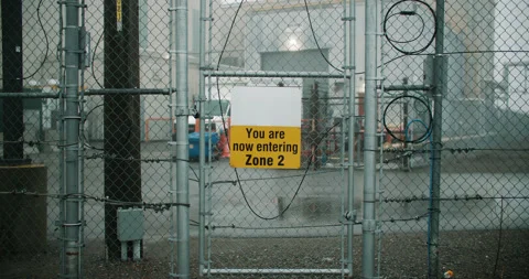 High-Security Electric Chain Link Fence Protecting Industrial Factory Stock Footage 236975126