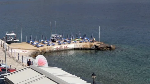 High shot, jetty with cafe and umbrellas Stock Footage 85848726