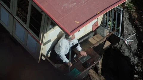 High-shot/ plongee: man drives a car cable Video stock 128091919