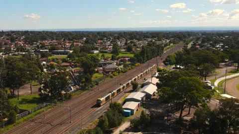 High shot of Train parked on rail track in Australia with suburbs Video stock 229112488