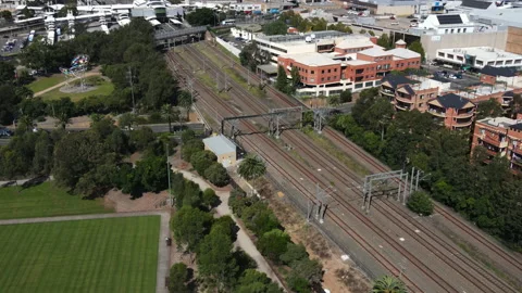 High shot of Train parked on rail track in Australia with suburbs Video stock 229114486