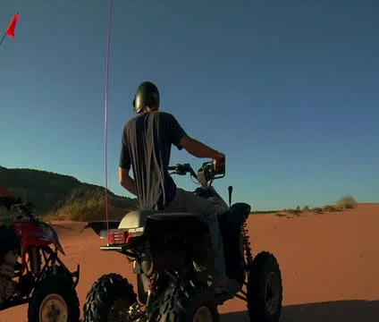 High shutter speed  ATV riders race on sand dunes Stock-Footage 21635902