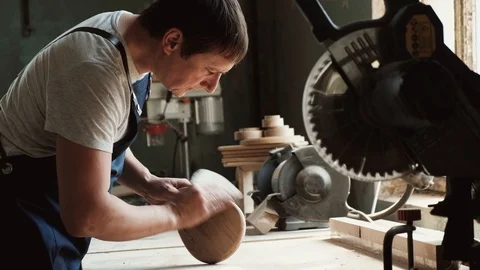 High skilled carpenter doing his work in wooden factory. Small business concept Stock Footage 123941791