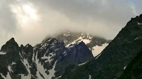 High Snowy Mountains with Clouds Evening Timelapse. Kavkaz region Stock Footage 65517950