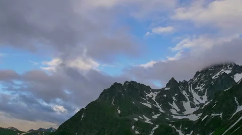 High Snowy Mountains with Clouds Evening Timelapse. Kavkaz region Stock Footage 65517987