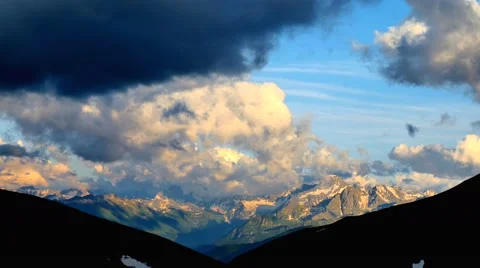 High Snowy Mountains with Clouds Sunset Timelapse. Kavkaz region Stock Footage 65764290