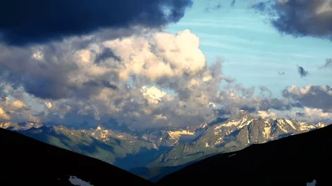High Snowy Mountains with Clouds Sunset Timelapse. Kavkaz region Stock Footage 71198916