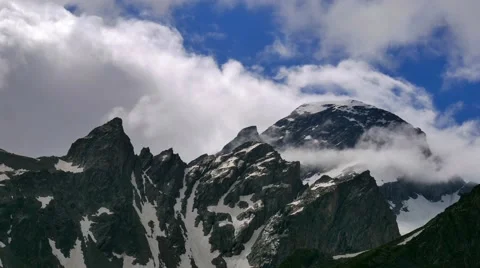 High Snowy Mountains with Clouds Timelapse. Kavkaz region Stock Footage 65517776