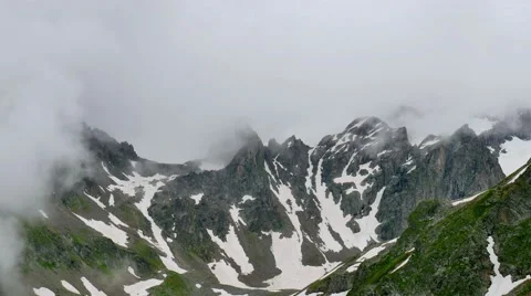 High Snowy Mountains with Clouds Timelapse on Overcast Days. Kavkaz region Stock-Footage 65518239