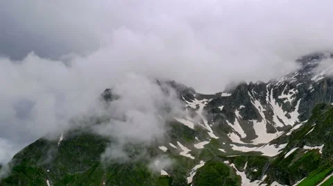 High Snowy Mountains with Clouds Timelapse on Overcast Days. Kavkaz region Stock Footage 65597975