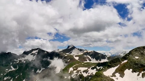 High Snowy Tops of Mountains with Clouds Timelapse. Kavkaz region 스톡 동영상 65764182