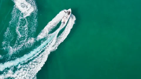 High speed boat chase jet ski in clear sea water drone following Stock Footage 120591053