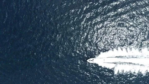 High-Speed Boat Cutting Through Crystal Clear Maldivian Waters - Aerial View Stock Footage 294037847