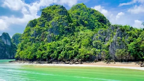 High speed boat gliding past pristine white sand beaches and limestone cliffs Stock Footage 326675422