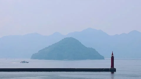 High-Speed Boat Passing Dragon Island and a Lighthouse on the Seto Inland Sea,4K 库存影片 340830650