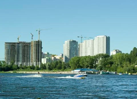 High-speed boat pulls a man on water skiing Stock Photos