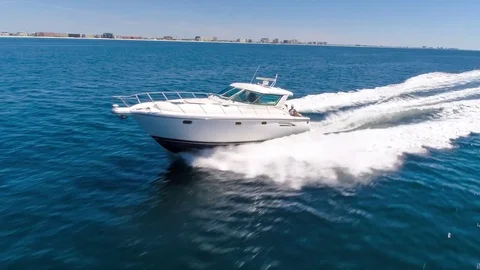 High speed boats in open water in the Gulf of Mexico Aerial Drone Chase Stock Footage