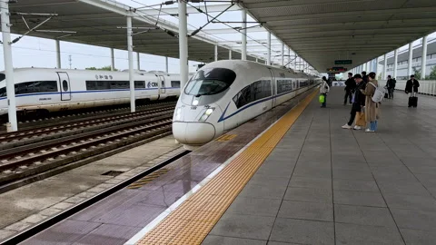 High-speed bullet train approaching the platform at Liyang Railway Station Stock Footage 290486858