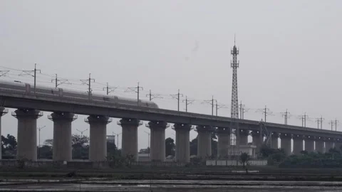 High-Speed Bullet Train Crossing Elevated Viaduct Bridge Stock Footage 343647675
