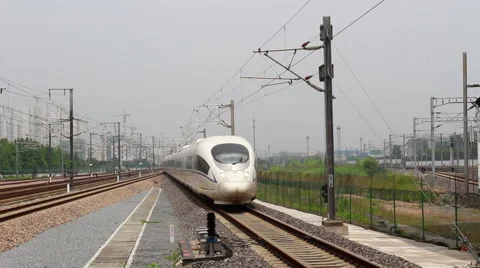 High speed bullet train driving on the railway, towards the camera lens Stock Footage 52534529