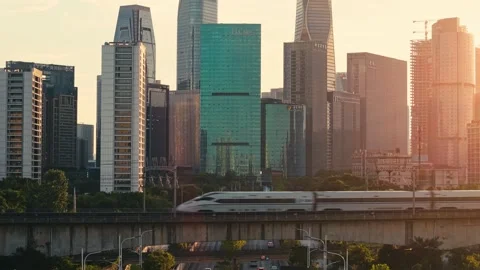 High speed bullet train moves across the city landscape of Hangzhou during the Video stock 340939822