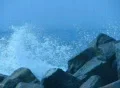 High Speed Camera : Ocean Waves 8 Waves crashing on rocks Loop Web Footage