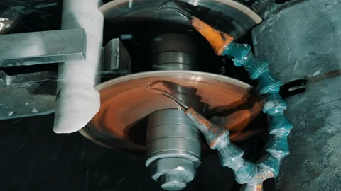High-speed CNC grinding wheel and coolant hose machining metal part Stock Footage 337926792