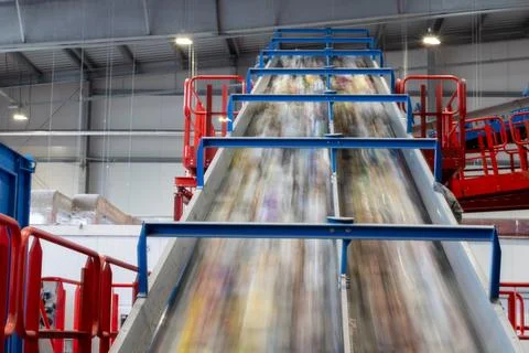 High speed conveyor system transporting waste in recycling plant Stock Photos