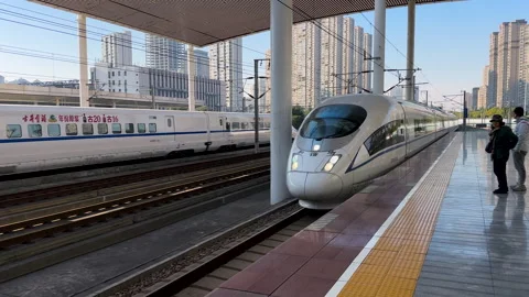 High-speed CRH train entering platform at Wuxi Railway Station Stock Footage 296644660
