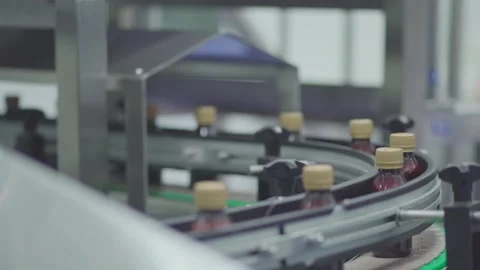 High Speed Curved Conveyor Line Moving Liquid Bottles in Pharmaceutical Plant Stock Footage 340600763