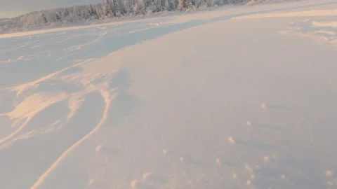 High-speed descent in winter from the high river bank. Snow tubing. Stock Footage 325859956