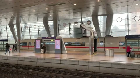 High speed Deutsche Bahn ICE train departs from Frankfurt airport train station Stock-Footage 229815067