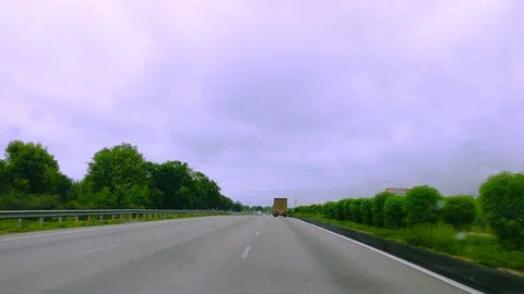 High speed drive on an indian highway with the overcast moonsoon sky and little Stock Footage 93001353