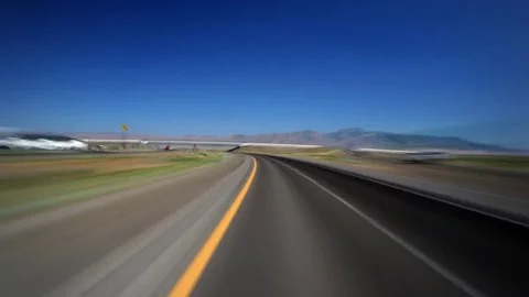 High-speed driver's POV of flat, straight highway near Winnemucca, Nevada Stock Footage 81194373