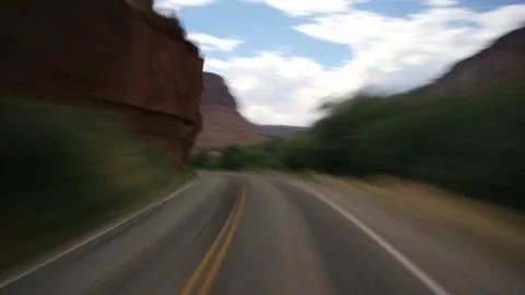 High-speed driver's POV of steep, winding canyon road near Moab, Utah Stock Footage 81194290