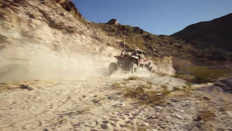 High speed driving quad 4x4 atv passing at dirt roads Stock Footage 212593565
