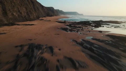 High-Speed Drone Flight Along Barriga Beach at Sunset in Portugal Stock Footage 229972016
