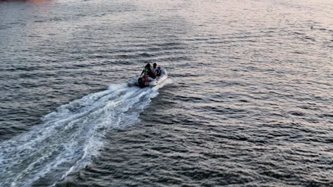 High Speed Drone Tracking Small Boat Under Fall River Bridge with Flyover Dusk Stock Footage 280363006