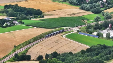 High speed electric passenger train traveling through rural Poland Stock Footage 344111550