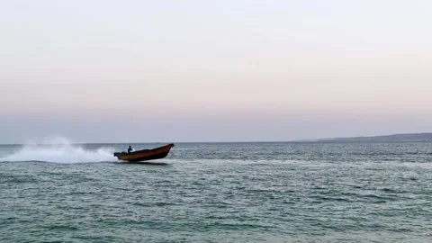 High speed fast moving jet boat riding on sea water surface splash water Stock Footage 278075608