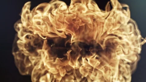 High speed flame blow. Flame blows on a black surface with a fantastic visual Stock Footage 128834313