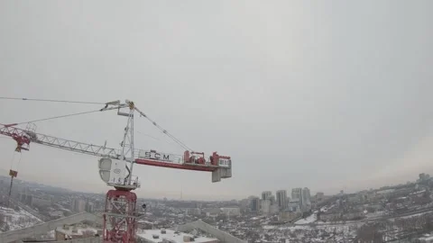 High speed flight of an FPV drone around a construction site crane Stock Footage 139609164