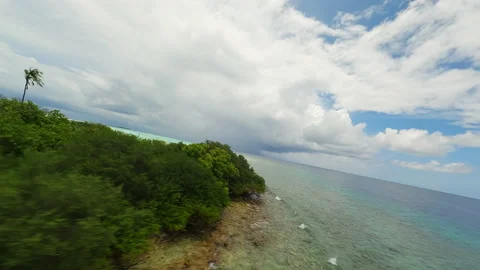 High speed flight over a desert island in the Maldives Stock Footage 239072474