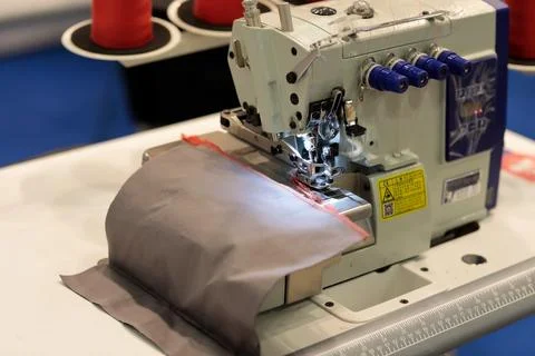High speed four thread industrial overlock Stock Photos