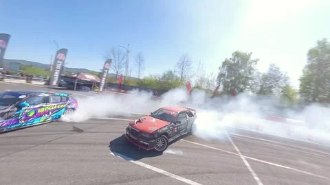 High-Speed FPV Drift Battle With Dense Tire Smoke Stock Footage 328469653