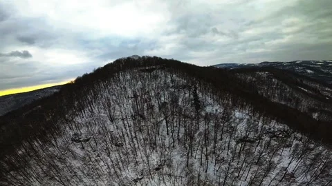 High Speed FPV Drone Flight Over Snowy Mountain Forest in Czechia Stock Footage 325738547