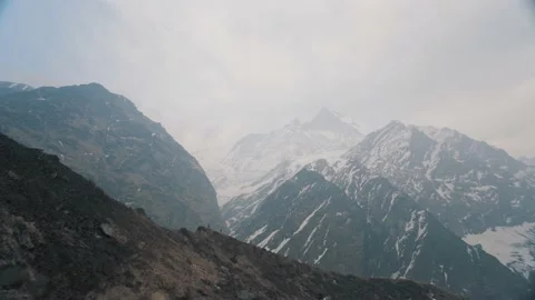 High Speed Frame View From MBC, Huge Mountain covered snow with small human Stock Footage 154020233