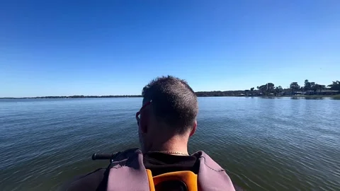 High-Speed Jet Ski Action on a Summer Lake Stock Footage 295816611