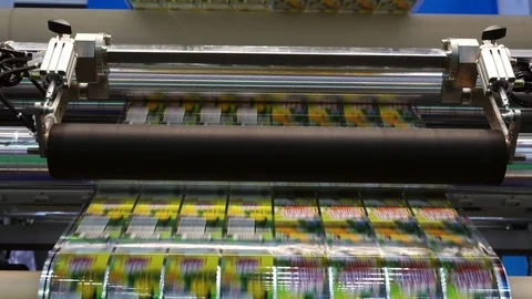 High speed labeling machine in industrial factory. Machine for sticker on produc Stock Footage 91769270