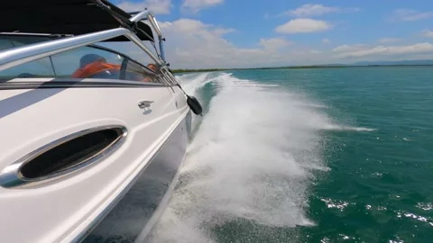 High speed motorboat moving fast on the surface of the sea. Splash from Stock Footage 233306352